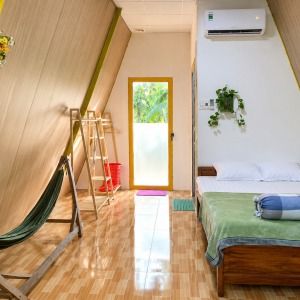 Spacious 50 m² private bungalow with air conditioning in a coconut garden homestay in Ben Tre