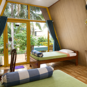 Spacious 50 m² private bungalow with air conditioning in a coconut garden homestay in Ben Tre