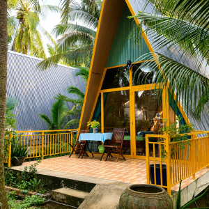 Bungalow surrounded by coconut trees at a homestay in Ben Tre, Vietnam
