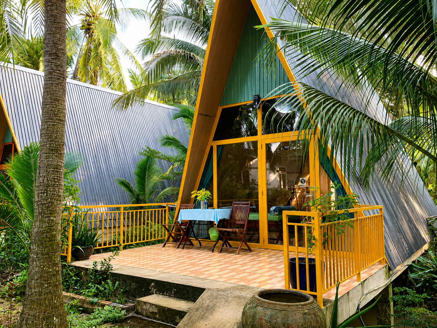 Bungalow surrounded by coconut trees at a homestay in Ben Tre, Vietnam