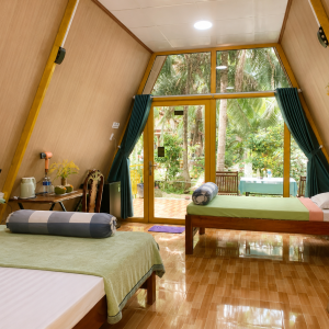 Spacious 50 m² private bungalow with air conditioning in a coconut garden homestay in Ben Tre
