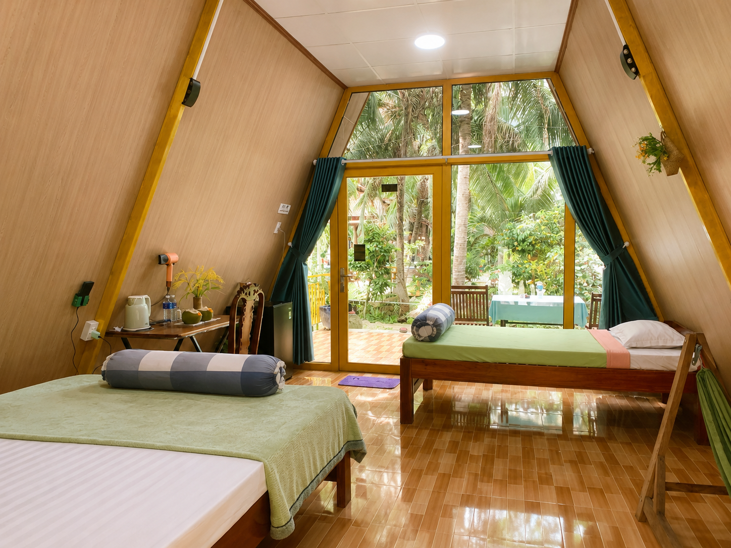 Spacious 50 m² private bungalow with air conditioning in a coconut garden homestay in Ben Tre