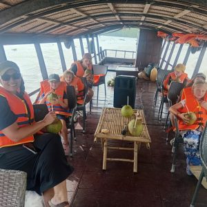 Tourists relaxing on a Ben Tre Mekong Delta boat tour