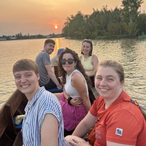 Tourists enjoying sunset sampan boat ride in Ben Tre Mekong Delta