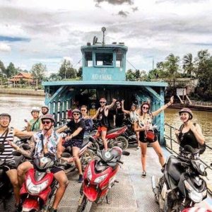 Tourists paddling through small canals in Ben Tre Mekong Delta Vietnam